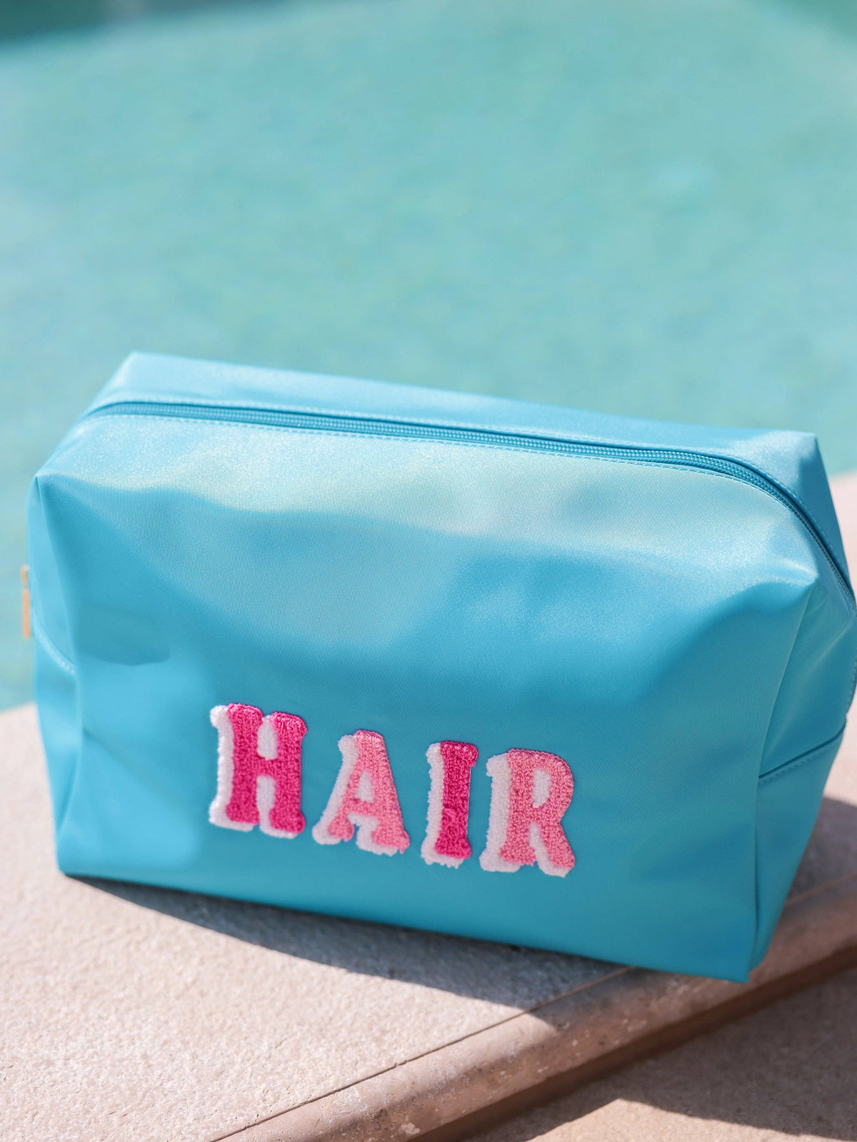 "HAIR" OVERSIZED ZIP POUCH, AZURE